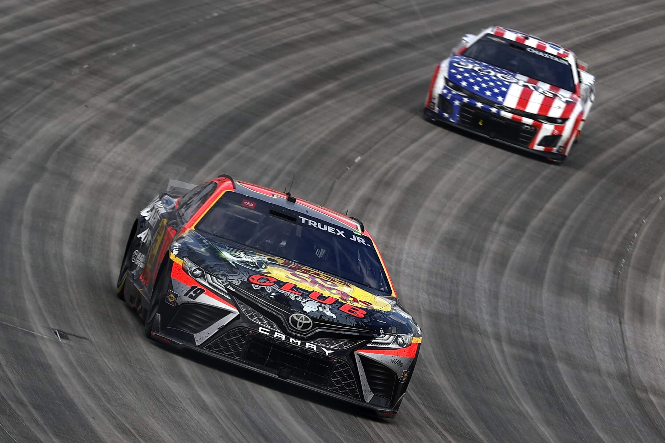 Martin Truex Jr., driver of the #19 Bass Pro Shops Toyota, and Ross Chastain, driver of the #1 Jockey Chevrolet, race during the NASCAR Cup Series Würth 400 at Dover International Speedway on May 01, 2023 in Dover, Delaware. (Photo by Tim Nwachukwu/Getty Images)